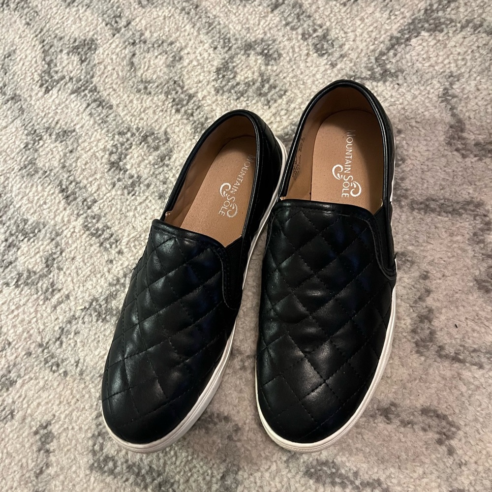 Women’s Black leather slip ons
